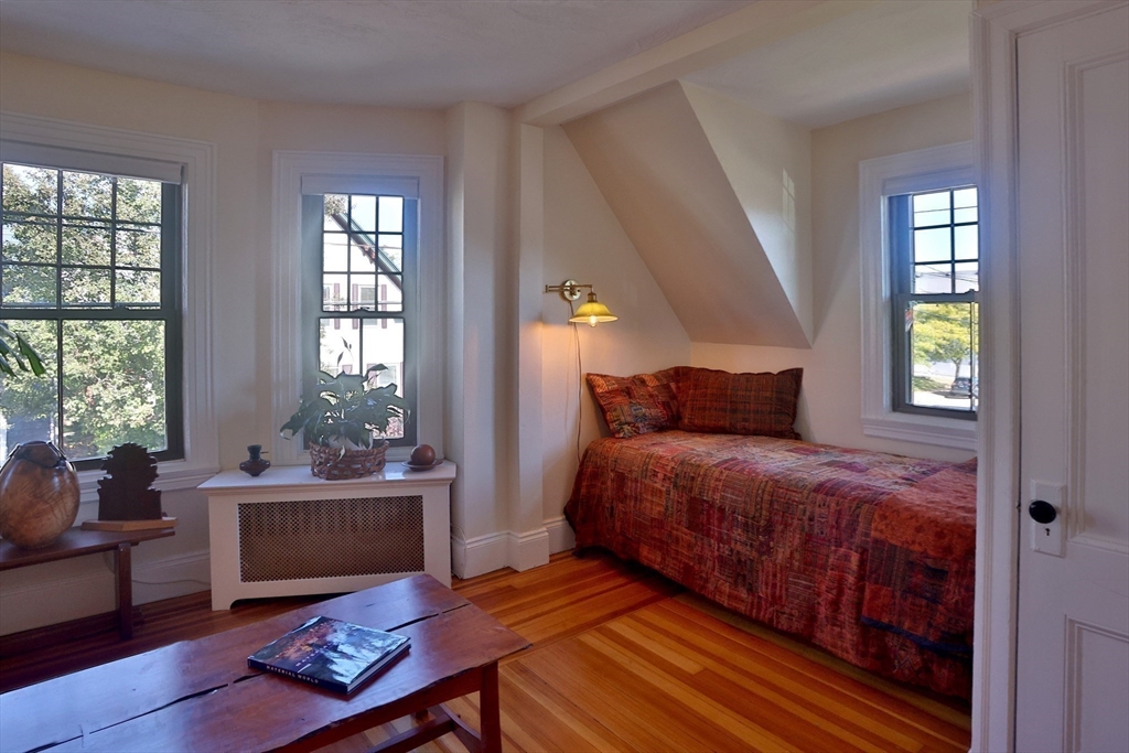 4 Willow Avenue, Unit 2 Salem, MA 01970 - Photo 13 of 41 a bedroom with a bed and windows