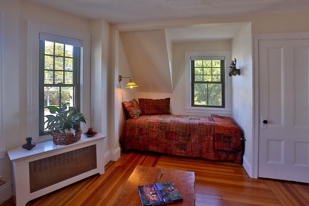 4 Willow Avenue, Unit 2 Salem, MA 01970 - Photo 14 of 41 a bedroom with a bed and a potted plant