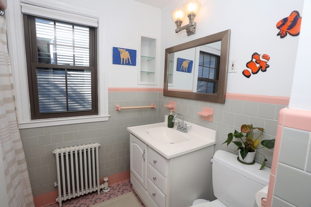 4 Willow Avenue, Unit 2 Salem, MA 01970 - Photo 22 of 41 a bathroom with a sink and a mirror