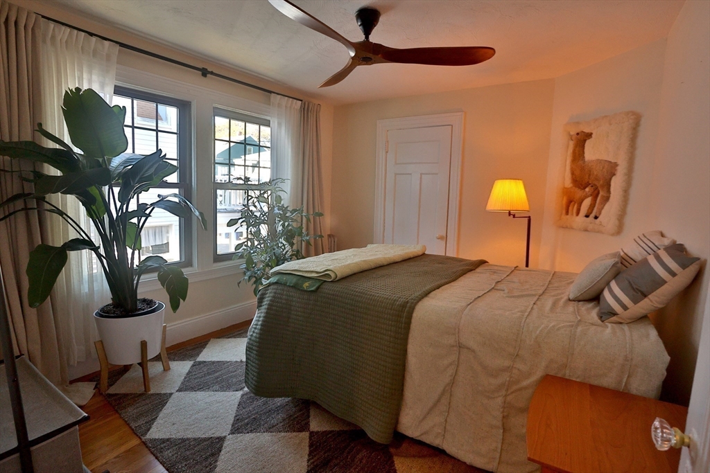 4 Willow Avenue, Unit 2 Salem, MA 01970 - Photo 23 of 41 a bedroom with a bed lamp closet and large window