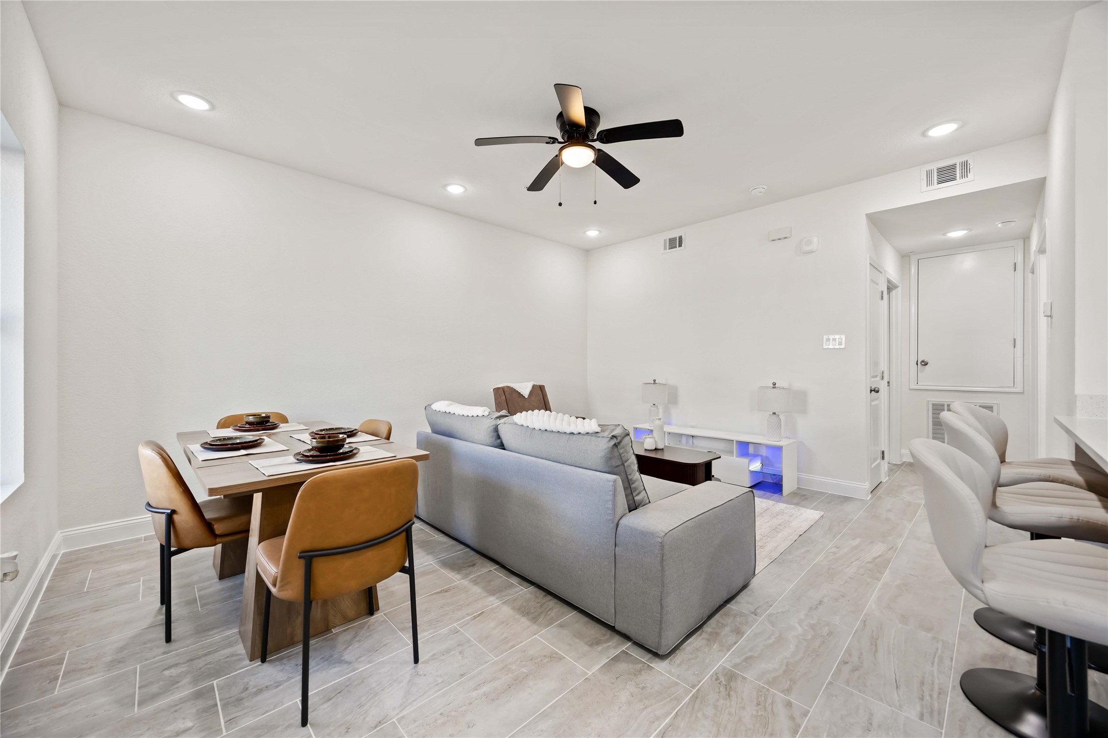 9129 Brandon Street, Unit A7 Houston, TX 77051 - Photo 2 of 15 a living room with furniture and a wooden floor