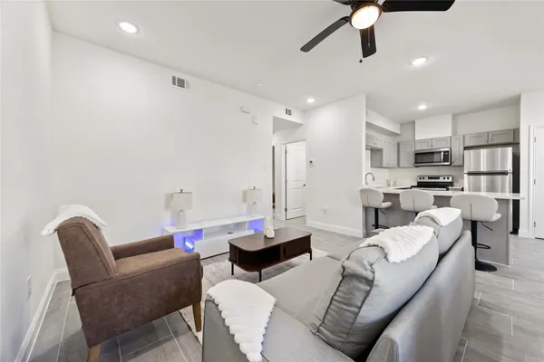 a kitchen with a sink appliances and cabinets