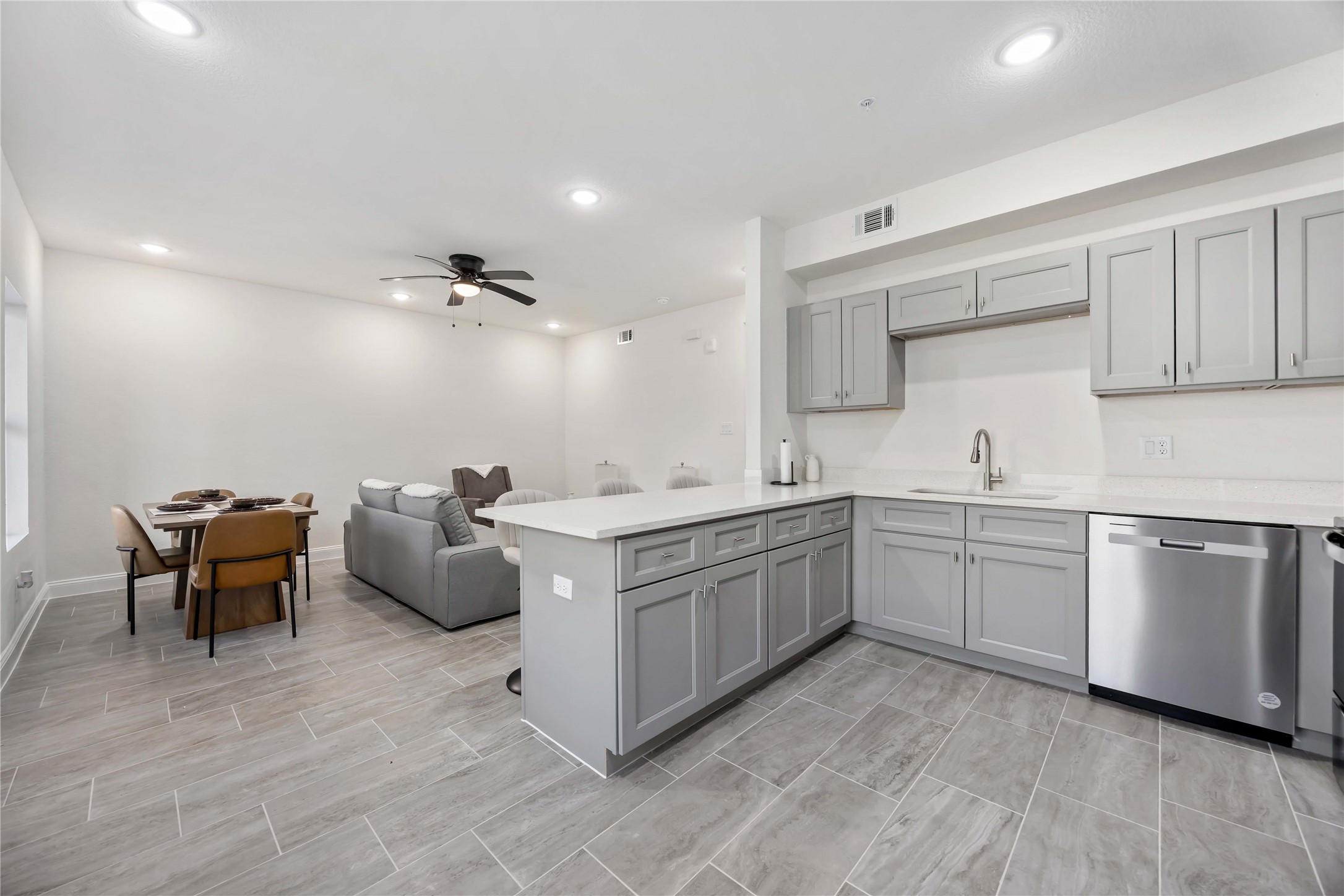9129 Brandon Street, Unit A7 Houston, TX 77051 - Photo 6 of 15 a kitchen with sink and white cabinets