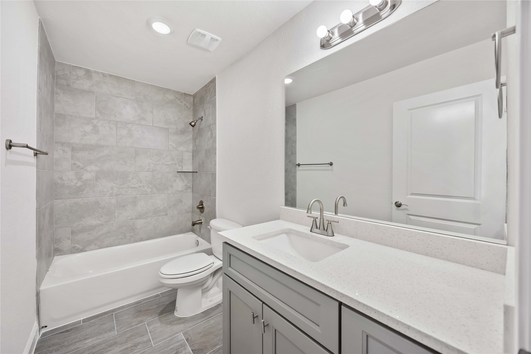 9129 Brandon Street, Unit A7 Houston, TX 77051 - Photo 10 of 15 a bathroom with a sink a toilet and shower