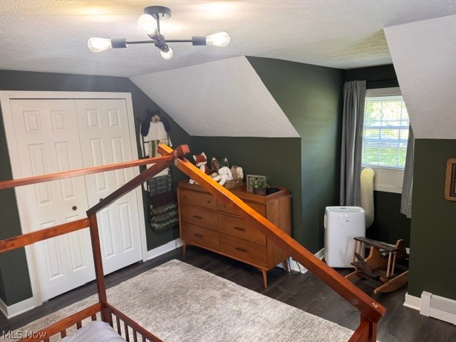 2760 Haines Road Madison, OH 44057 - Photo 22 of 33 Room featuring wood-finish flooring, a window with curtains, and a ceiling-mounted light fixture