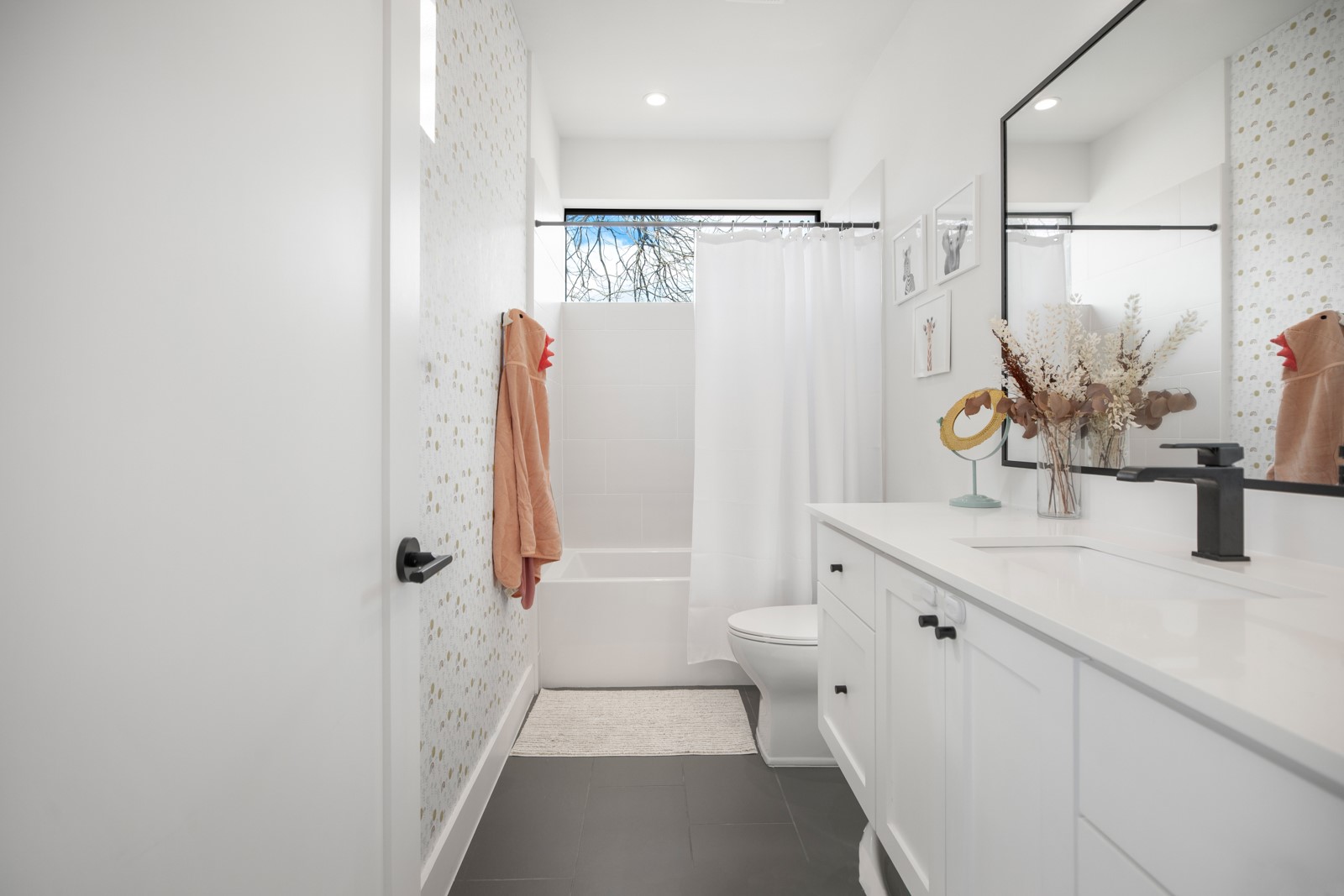1410 East 3rd Street, Unit A Austin, TX 78702 - Photo 24 of 40 a bathroom with a double vanity sink toilet and shower