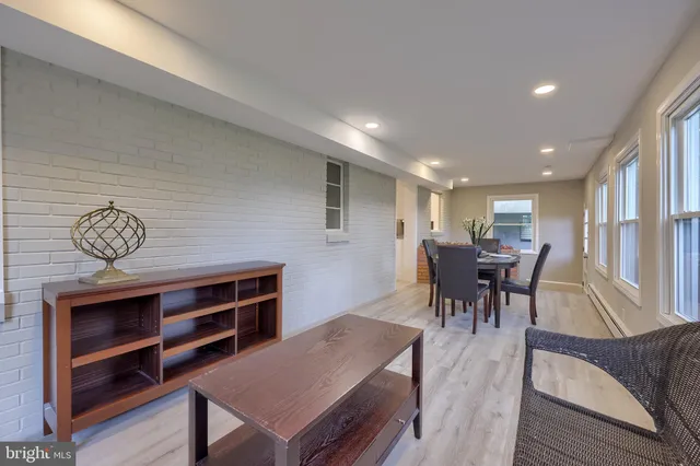 a view of a dining room with furniture and a table