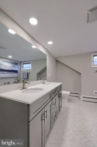 a kitchen with a sink and a refrigerator
