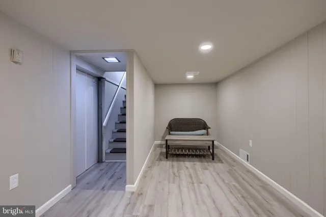 a room with stairs and a wooden floor