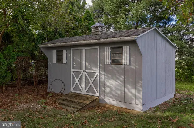 a side view of a house with garden