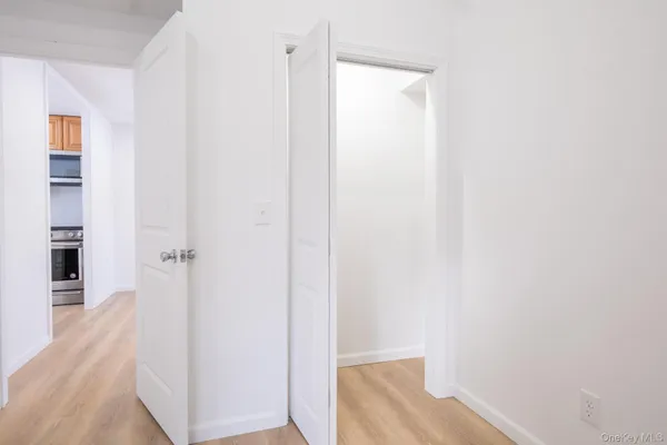 a kitchen with granite countertop a stove a sink and a microwave