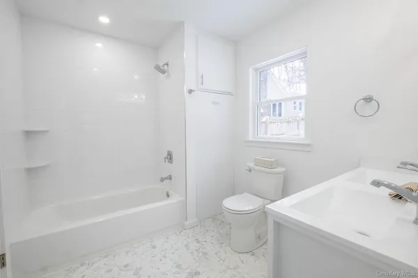 a kitchen with stainless steel appliances granite countertop a sink and a microwave