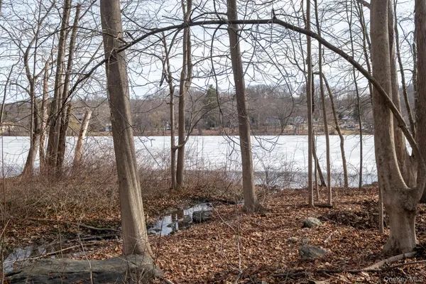 a view of a living room hardwood and a window