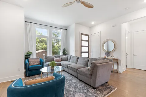 a living room with furniture and a large window