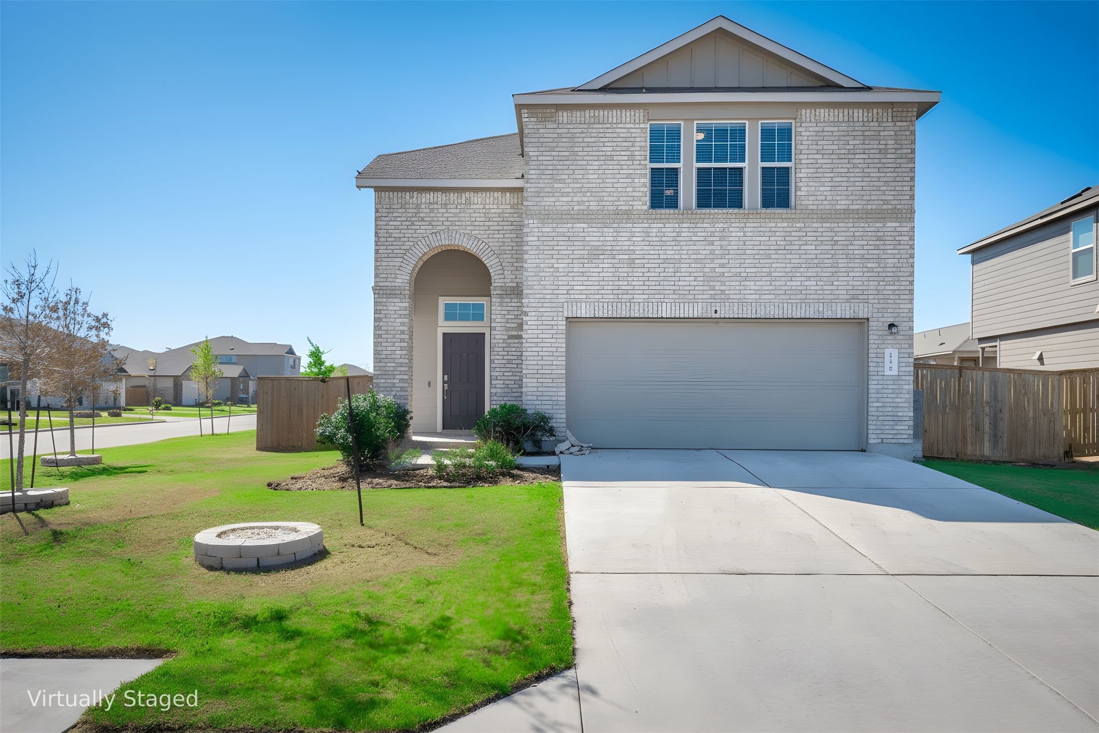 156 Greatest Gift Way Jarrell, TX 76537 - Photo 1 of 40 a front view of a house with garden