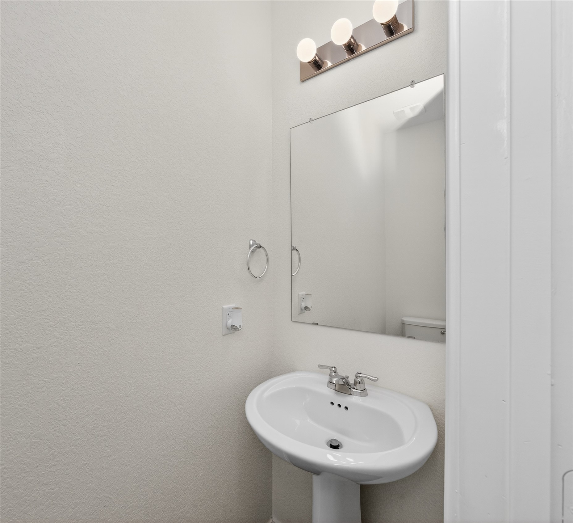 156 Greatest Gift Way Jarrell, TX 76537 - Photo 13 of 40 a bathroom with a sink and a mirror