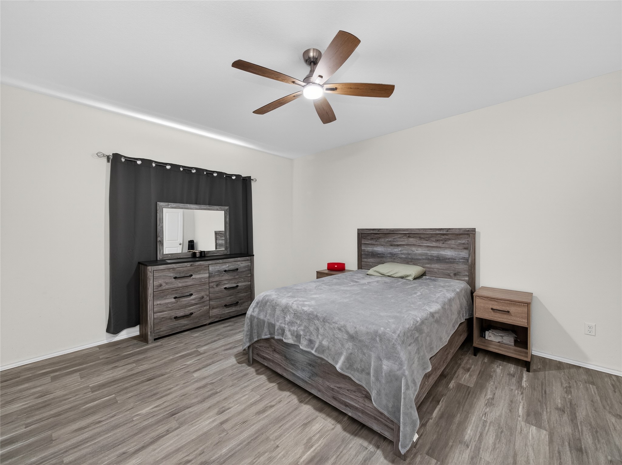 156 Greatest Gift Way Jarrell, TX 76537 - Photo 14 of 40 a bedroom with a bed and a dresser