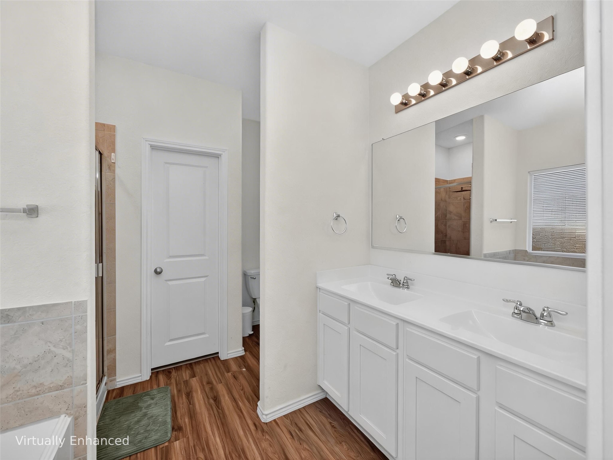156 Greatest Gift Way Jarrell, TX 76537 - Photo 16 of 40 a spacious bathroom with a sink and a mirror