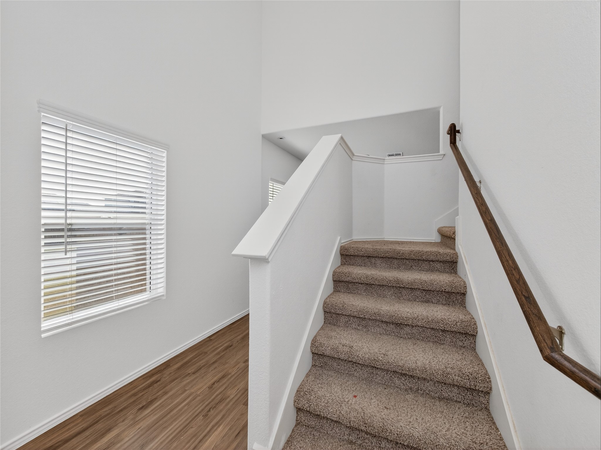 156 Greatest Gift Way Jarrell, TX 76537 - Photo 19 of 40 a view of staircase with white walls and a window