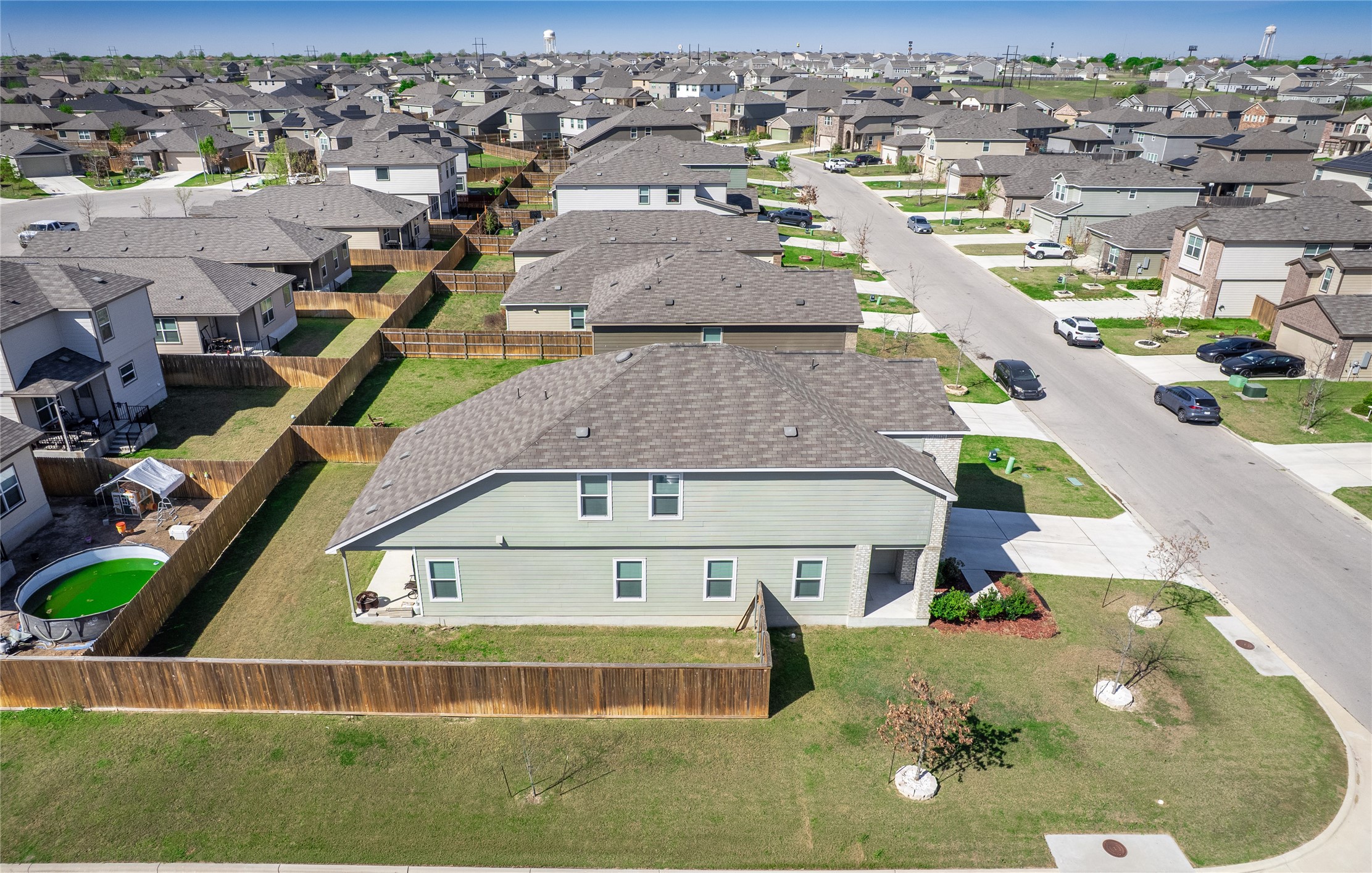156 Greatest Gift Way Jarrell, TX 76537 - Photo 36 of 40 an aerial view of a house with a swimming pool