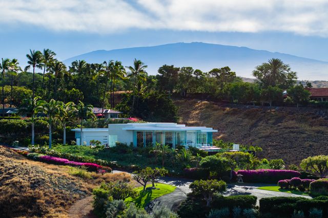 a view of a chairs and table in a patio