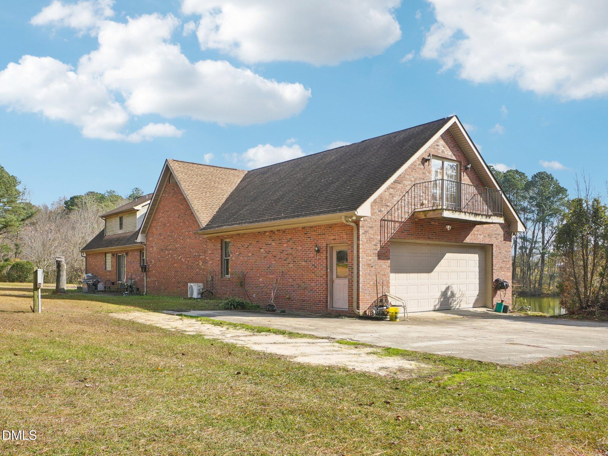 750 Stephenson Road Benson, NC 27504 - Photo 16 of 21 a view of a house with a yard