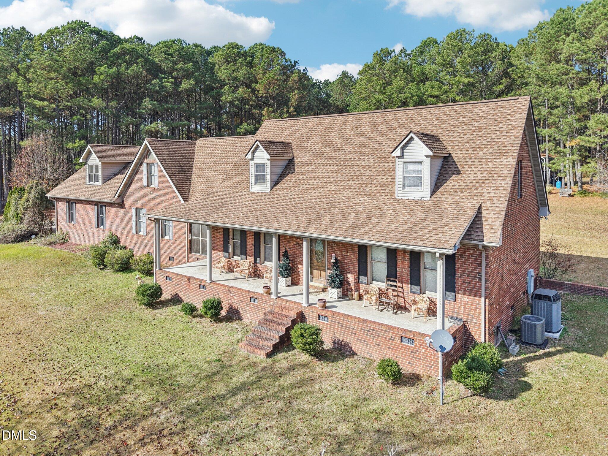 750 Stephenson Road Benson, NC 27504 - Photo 2 of 21 a view of a house with pool and sitting area