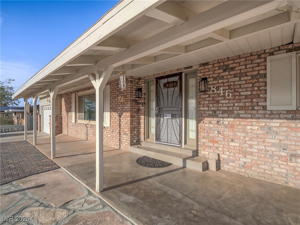 846 Fairview Drive Henderson, NV 89015 - Photo 11 of 39 View of exterior entry featuring a porch and brick siding