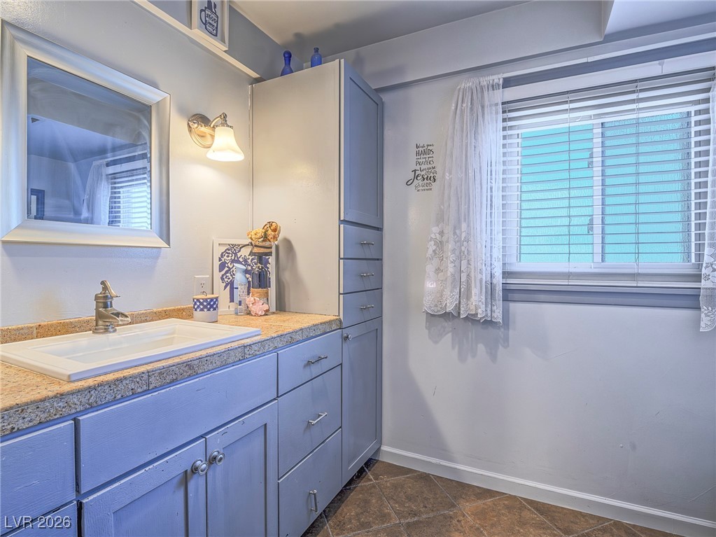 846 Fairview Drive Henderson, NV 89015 - Photo 22 of 39 Bathroom with vanity and dark tile patterned flooring