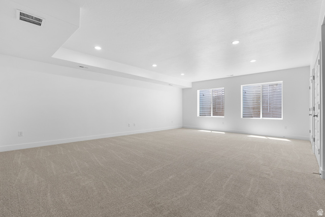 43 South Crimson Way, Unit 311 Mapleton, UT 84664 - Photo 17 of 28 Spacious room featuring neutral carpeting, white walls, recessed lighting, and two windows with window wells