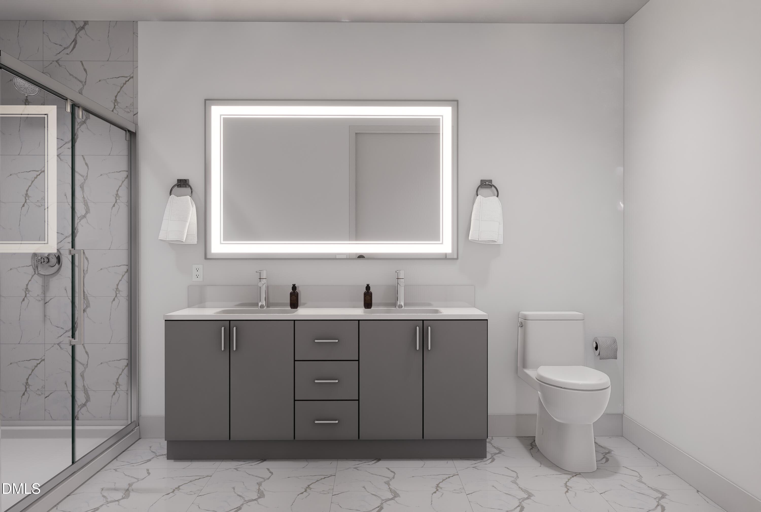 709 East Lenoir Street, Unit 101 Raleigh, NC 27601 - Photo 7 of 16 a bathroom with a toilet sink and mirror