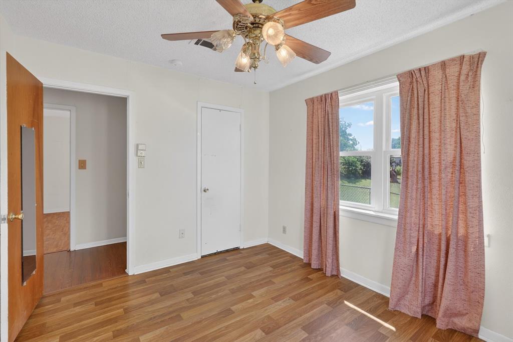 624 North Ave A Springtown, TX 76082 - Photo 19 of 29 a view of empty room with window and ceiling fan