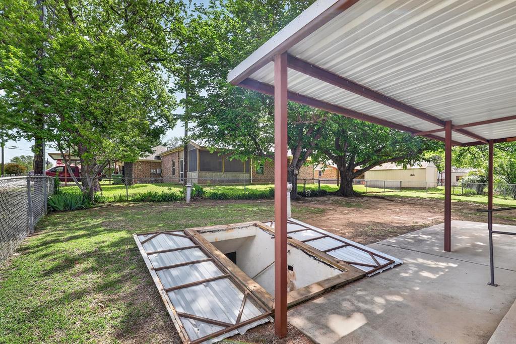 624 North Ave A Springtown, TX 76082 - Photo 23 of 29 a view of a patio with a table chairs and a backyard