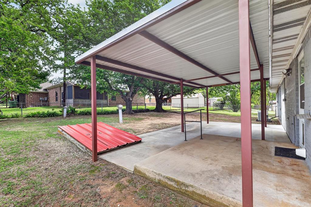 624 North Ave A Springtown, TX 76082 - Photo 25 of 29 a patio with a table and chairs