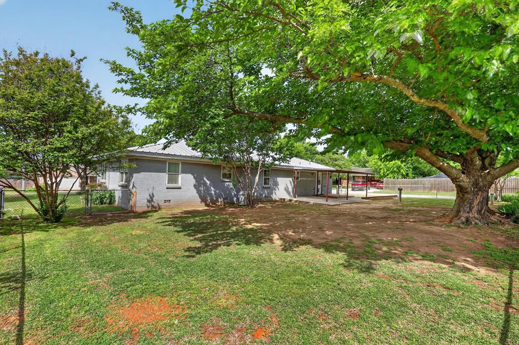 624 North Ave A Springtown, TX 76082 - Photo 27 of 29 a view of a yard in front of a house with large trees