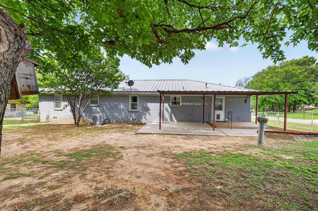 624 North Ave A Springtown, TX 76082 - Photo 28 of 29 a house with a tree in front of it