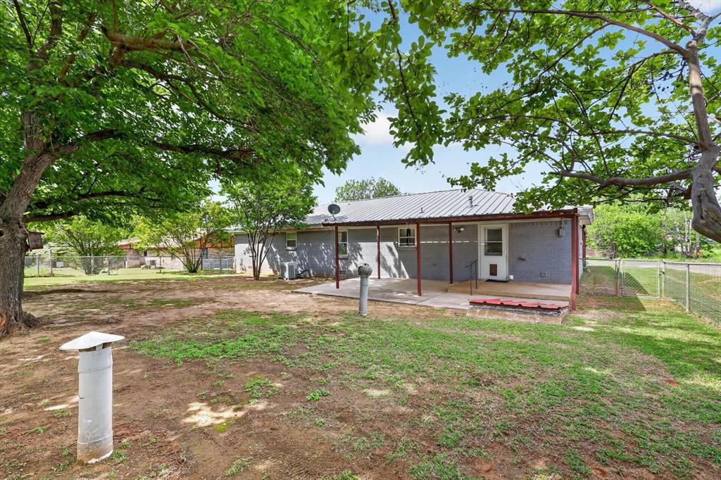 624 North Ave A Springtown, TX 76082 - Photo 29 of 29 a house that has a tree in front of it
