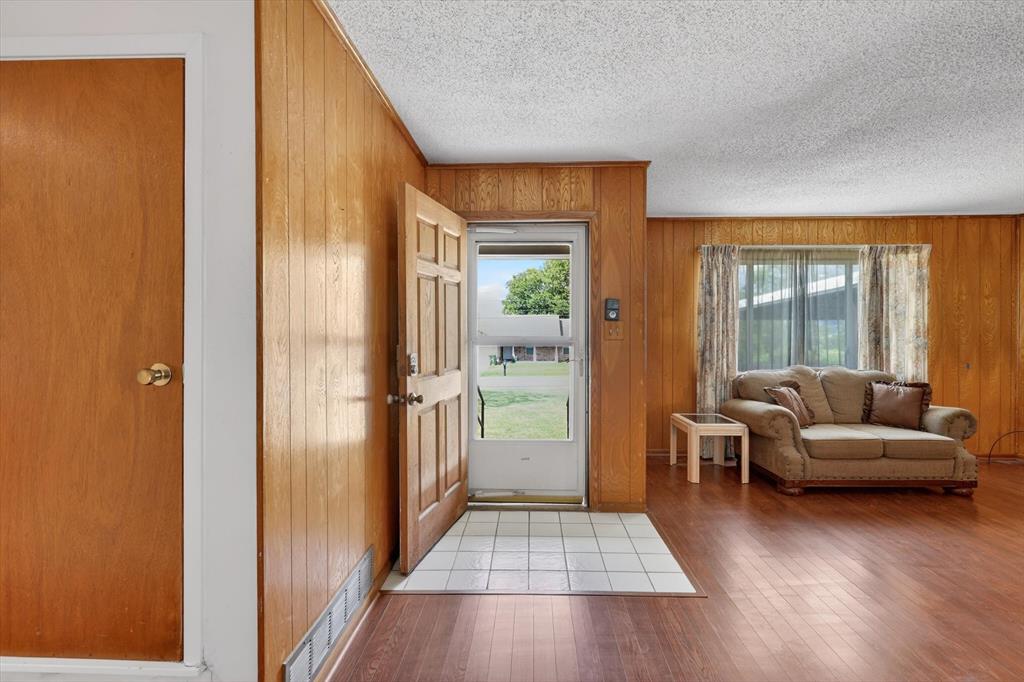 624 North Ave A Springtown, TX 76082 - Photo 6 of 29 a living room with furniture and a large window