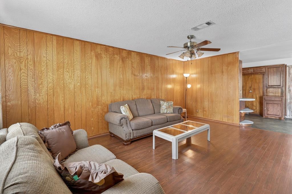 624 North Ave A Springtown, TX 76082 - Photo 8 of 29 a living room with furniture and a wooden floor