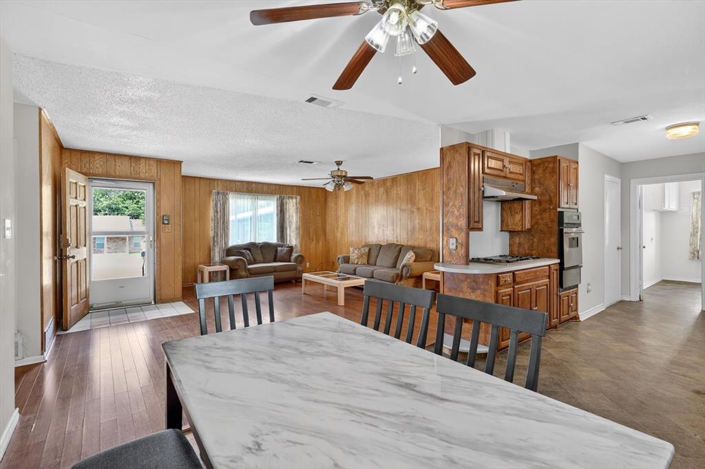 624 North Ave A Springtown, TX 76082 - Photo 10 of 29 a view of a dining room with furniture and wooden floor
