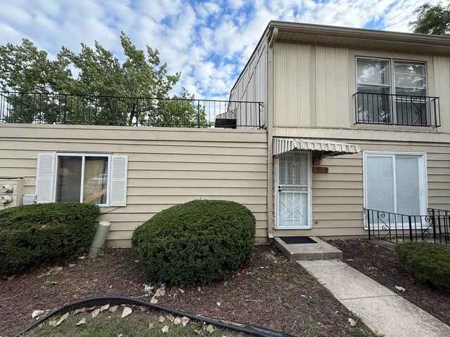 a view of a house with a yard and garage