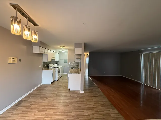 a kitchen with a stove and a refrigerator