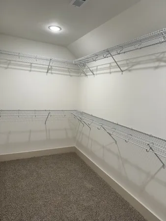 a view of a room with racks on the wall