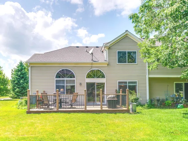 a front view of house with yard outdoor seating and barbeque oven