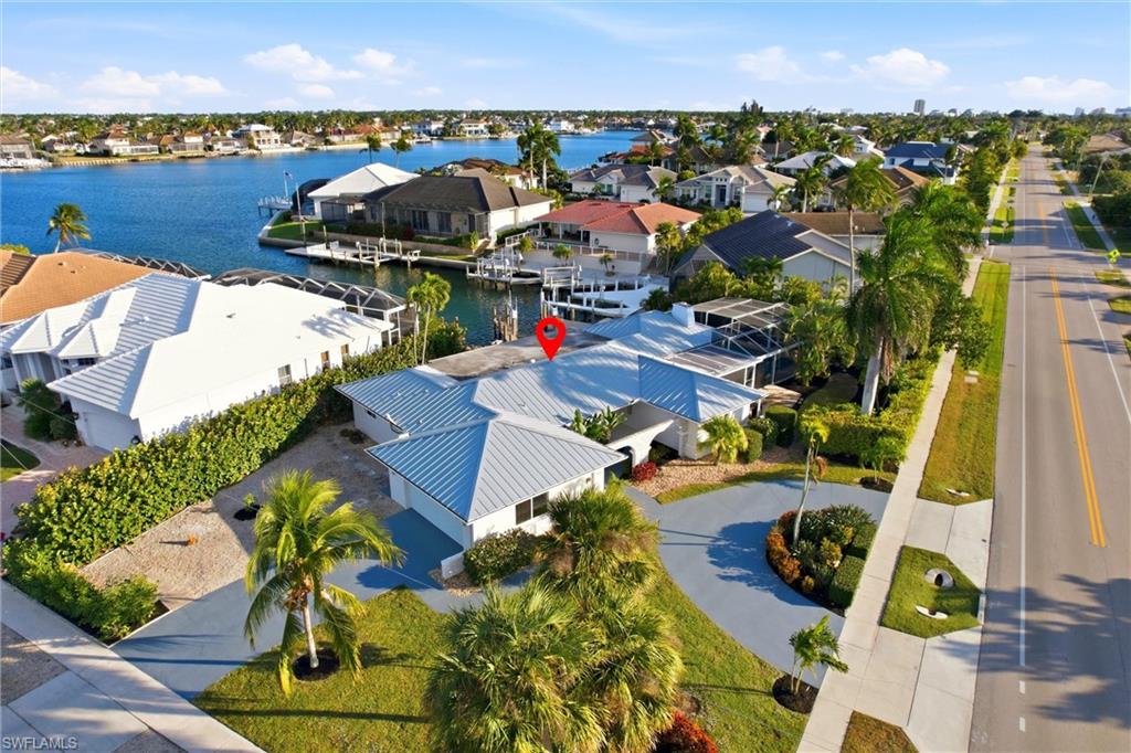 339 Landmark Street Marco Island, FL 34145 - Photo 49 of 50 Aerial view of residential area featuring a nearby body of water