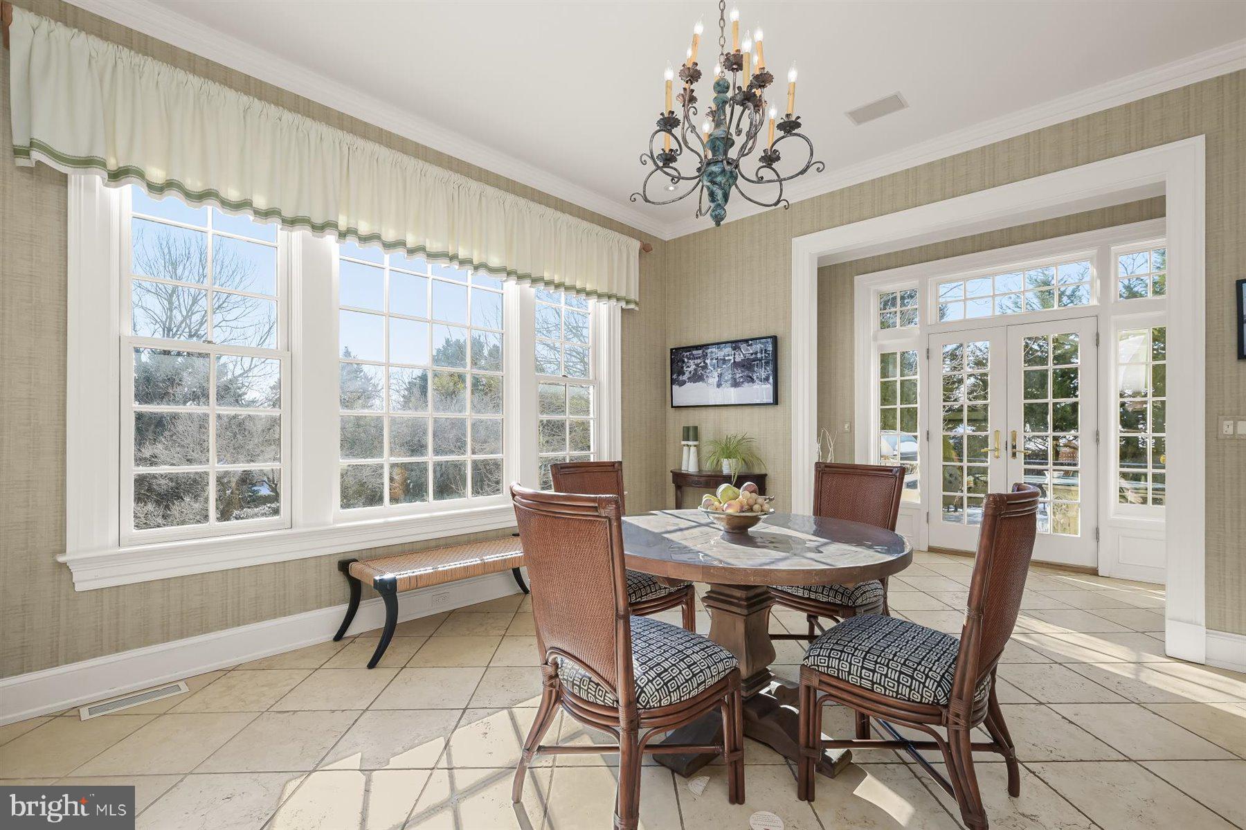 5320 27th Street Northwest Washington, DC 20015 - Photo 18 of 42 a dining room with furniture a chandelier and wooden floor