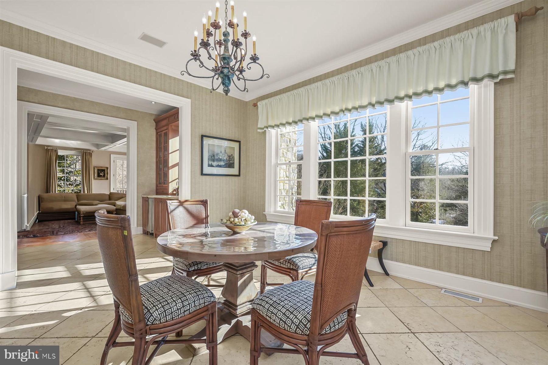 5320 27th Street Northwest Washington, DC 20015 - Photo 20 of 42 a dining room with furniture a chandelier and wooden floor