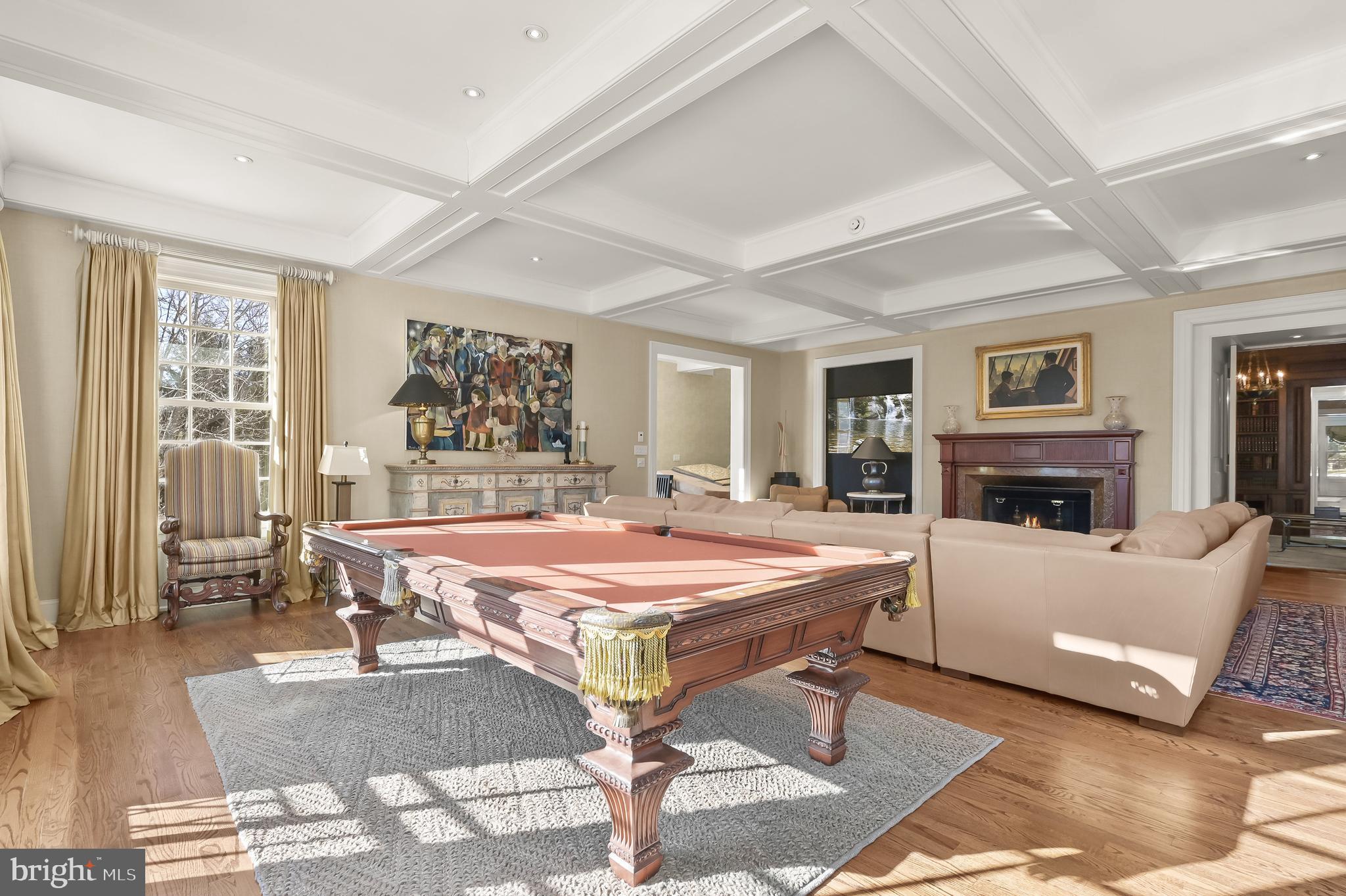 5320 27th Street Northwest Washington, DC 20015 - Photo 24 of 42 a living room with a pool table and a fireplace