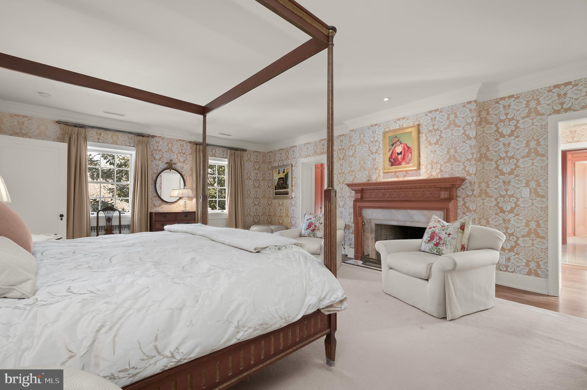 5320 27th Street Northwest Washington, DC 20015 - Photo 27 of 42 a spacious bedroom with a bed and a fireplace