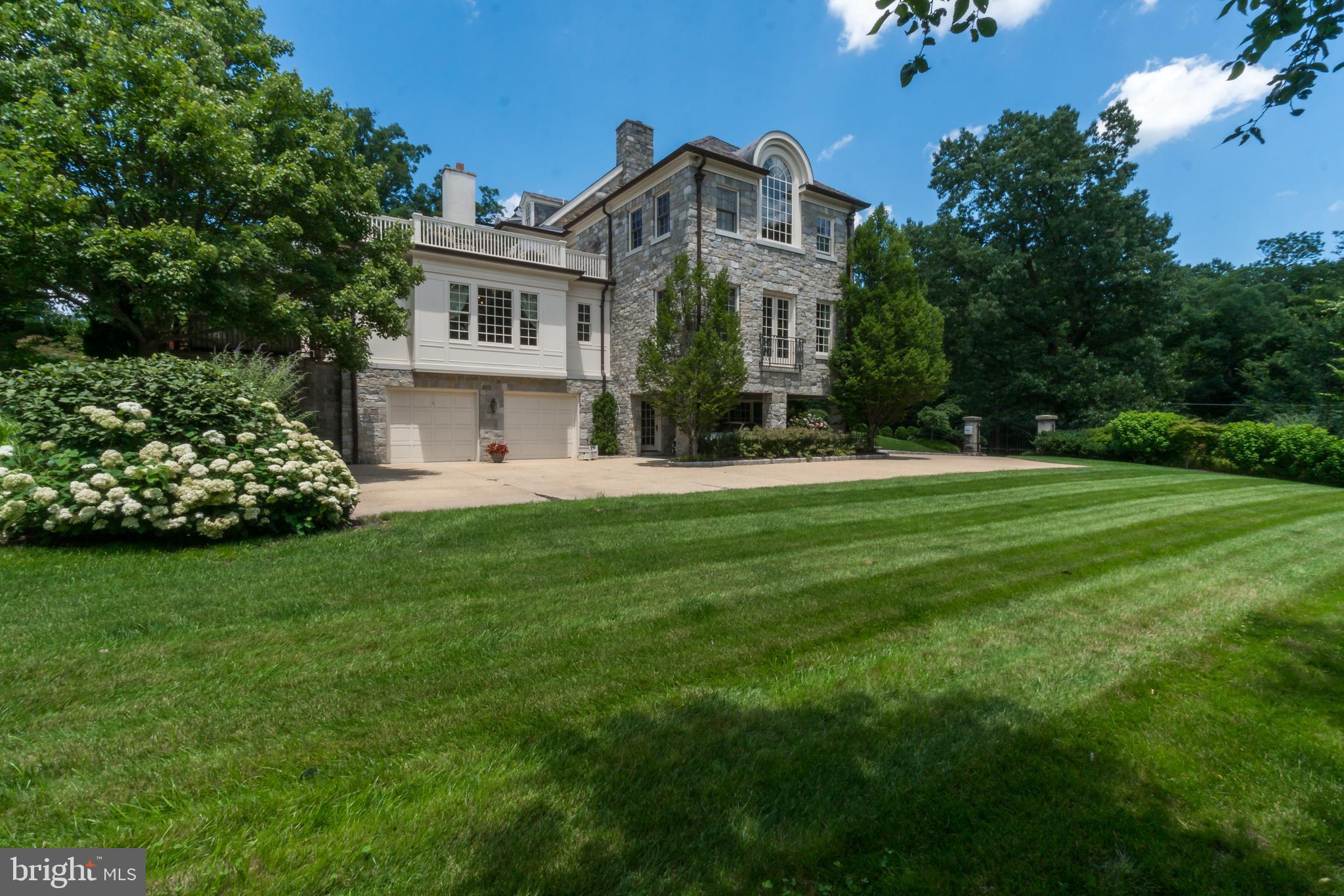 5320 27th Street Northwest Washington, DC 20015 - Photo 37 of 42 a front view of a house with a yard